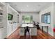 Bright office space with hardwood floors, built-in shelving, large windows and a desk at 141 S Phelps Ave, Winter Park, FL 32789