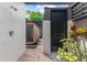 This outdoor spa area includes a barrel sauna, outdoor shower, and tropical landscaping at 141 S Phelps Ave, Winter Park, FL 32789
