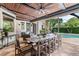 Inviting outdoor patio with wood ceiling, ceiling fan, and a view of the refreshing pool at 141 S Phelps Ave, Winter Park, FL 32789