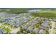 Aerial view of a neighborhood with houses and trees on a sunny day at 14244 Walcott Ave, Orlando, FL 32827