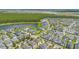 Community with beautiful lake view and many trees from an aerial view at 14244 Walcott Ave, Orlando, FL 32827