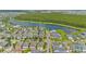 Community with a lake view, lush green trees, and single Gathering homes at 14244 Walcott Ave, Orlando, FL 32827