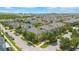 Aerial view of neighborhood homes, tree lined streets, and a sunny day at 14244 Walcott Ave, Orlando, FL 32827
