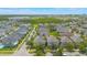 Aerial view of community with houses and lake on a beautiful sunny day at 14244 Walcott Ave, Orlando, FL 32827