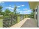 This charming private balcony offers plenty of space with wrought iron railings and tree views at 14244 Walcott Ave, Orlando, FL 32827