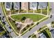 Aerial view of a neighborhood park with lush green grass, playground and sidewalks at 14244 Walcott Ave, Orlando, FL 32827