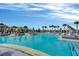 Community pool with lounge chairs, cabanas, and inviting blue water at 14244 Walcott Ave, Orlando, FL 32827