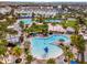 Aerial view of resort-style pools surrounded by palm trees at the Lake Nona community at 14244 Walcott Ave, Orlando, FL 32827