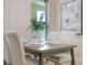 Inviting dining area showcasing a wood table, seating for four, and light, neutral walls at 14244 Walcott Ave, Orlando, FL 32827