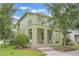 Two-story home featuring a second-story balcony and an inviting brick staircase at 14244 Walcott Ave, Orlando, FL 32827