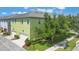 A view of a three-story townhome showing the side of the home and an attached garage at 14244 Walcott Ave, Orlando, FL 32827