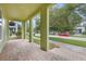 Covered porch featuring a brick paved floor and ample space with view of the street at 14244 Walcott Ave, Orlando, FL 32827