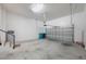 Spacious garage with a manual chain lift for the garage door and a water heater at 14244 Walcott Ave, Orlando, FL 32827