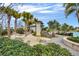 Relaxation area featuring hammocks, palm trees, and a nearby pool with lounge chairs at 14244 Walcott Ave, Orlando, FL 32827