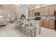 Open-concept kitchen boasts a large island, ample cabinetry, and modern appliances at 14244 Walcott Ave, Orlando, FL 32827