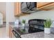 Close-up of a kitchen counter featuring sleek black appliances and modern decor at 14244 Walcott Ave, Orlando, FL 32827