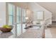 Kitchen island detail highlighting granite countertops and a modern sink, connecting to the living area at 14244 Walcott Ave, Orlando, FL 32827