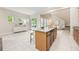 Bright open-concept kitchen flows into the living area featuring large center island with room for seating at 14244 Walcott Ave, Orlando, FL 32827