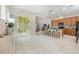 Open-concept living space with a kitchen island, sliding glass doors, and contemporary design at 14244 Walcott Ave, Orlando, FL 32827