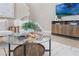 Bright living room with a round glass coffee table, comfortable seating, and stylish decor at 14244 Walcott Ave, Orlando, FL 32827