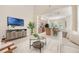 Open-concept living area flows into the kitchen and dining space at 14244 Walcott Ave, Orlando, FL 32827
