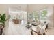 Bright, spacious living area with a cozy seating arrangement and an open connection to the dining area at 14244 Walcott Ave, Orlando, FL 32827