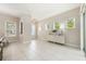 Spacious living room with tile flooring and natural light from large windows at 14244 Walcott Ave, Orlando, FL 32827