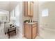 Living room with a view of the powder room, cabinets, and a view of the windows at 14244 Walcott Ave, Orlando, FL 32827
