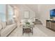 Inviting living room featuring neutral tones, modern furnishings, and an open staircase at 14244 Walcott Ave, Orlando, FL 32827