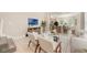 Open-concept living space with modern furnishings, a flat-screen TV, and an adjacent kitchen at 14244 Walcott Ave, Orlando, FL 32827