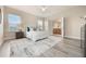 Bright main bedroom with an en suite bathroom, ample natural light, and stylish decor at 14244 Walcott Ave, Orlando, FL 32827