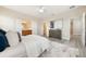 Comfortable main bedroom featuring a view of en suite bathroom, closet, and hall, offering convenience at 14244 Walcott Ave, Orlando, FL 32827