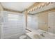 Bathroom with a floral border, a sink and a large mirror at 144 Henue Ct, Davenport, FL 33896