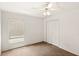 Clean bedroom featuring neutral paint, carpet, a closet, and a ceiling fan at 144 Henue Ct, Davenport, FL 33896
