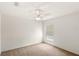 Clean bedroom featuring neutral paint, carpet, and a ceiling fan at 144 Henue Ct, Davenport, FL 33896