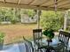 Outdoor dining on a covered patio offers backyard views at 1449 Amanda Rd, Kissimmee, FL 34744