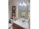 Charming bathroom features vanity, sink, mirror and lighting at 1449 Amanda Rd, Kissimmee, FL 34744