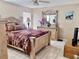 Serene main bedroom with decorative bed frame, matching furniture, and soft lighting for a restful retreat at 1449 Amanda Rd, Kissimmee, FL 34744