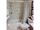 Renovated bathroom features a shower-tub combination with bright lighting at 1449 Amanda Rd, Kissimmee, FL 34744