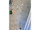 Spacious shower with white marble walls and mosaic tile floors at 1449 Amanda Rd, Kissimmee, FL 34744
