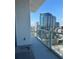 Condo balcony with glass railing and a beautiful view of the city skyline at 150 E Robinson St # 2002, Orlando, FL 32801