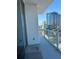 Condo balcony with glass railing and a beautiful view of the city skyline at 150 E Robinson St # 2002, Orlando, FL 32801