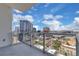 Beautiful balcony view of downtown city with clear glass railing and concrete floor at 150 E Robinson St # 2002, Orlando, FL 32801