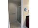 Modern bathroom with glass shower, tiled floors, and convenient vanity setup at 150 E Robinson St # 2002, Orlando, FL 32801