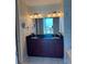 Elegant bathroom with dual sinks, granite countertop, ample cabinet space, and modern fixtures at 150 E Robinson St # 2002, Orlando, FL 32801
