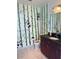 Whimsical bathroom featuring bamboo-themed wallpaper and a dark vanity at 150 E Robinson St # 2002, Orlando, FL 32801