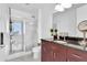 Bright bathroom with glass-enclosed shower, modern fixtures, and an updated vanity at 150 E Robinson St # 2002, Orlando, FL 32801