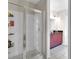 Bright bathroom featuring a glass-enclosed shower and a vanity with a black countertop at 150 E Robinson St # 2002, Orlando, FL 32801