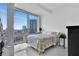 Bright bedroom with floor-to-ceiling windows providing an amazing city view at 150 E Robinson St # 2002, Orlando, FL 32801