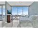 Cozy bedroom with a large window offering panoramic city views and stylish furniture at 150 E Robinson St # 2002, Orlando, FL 32801